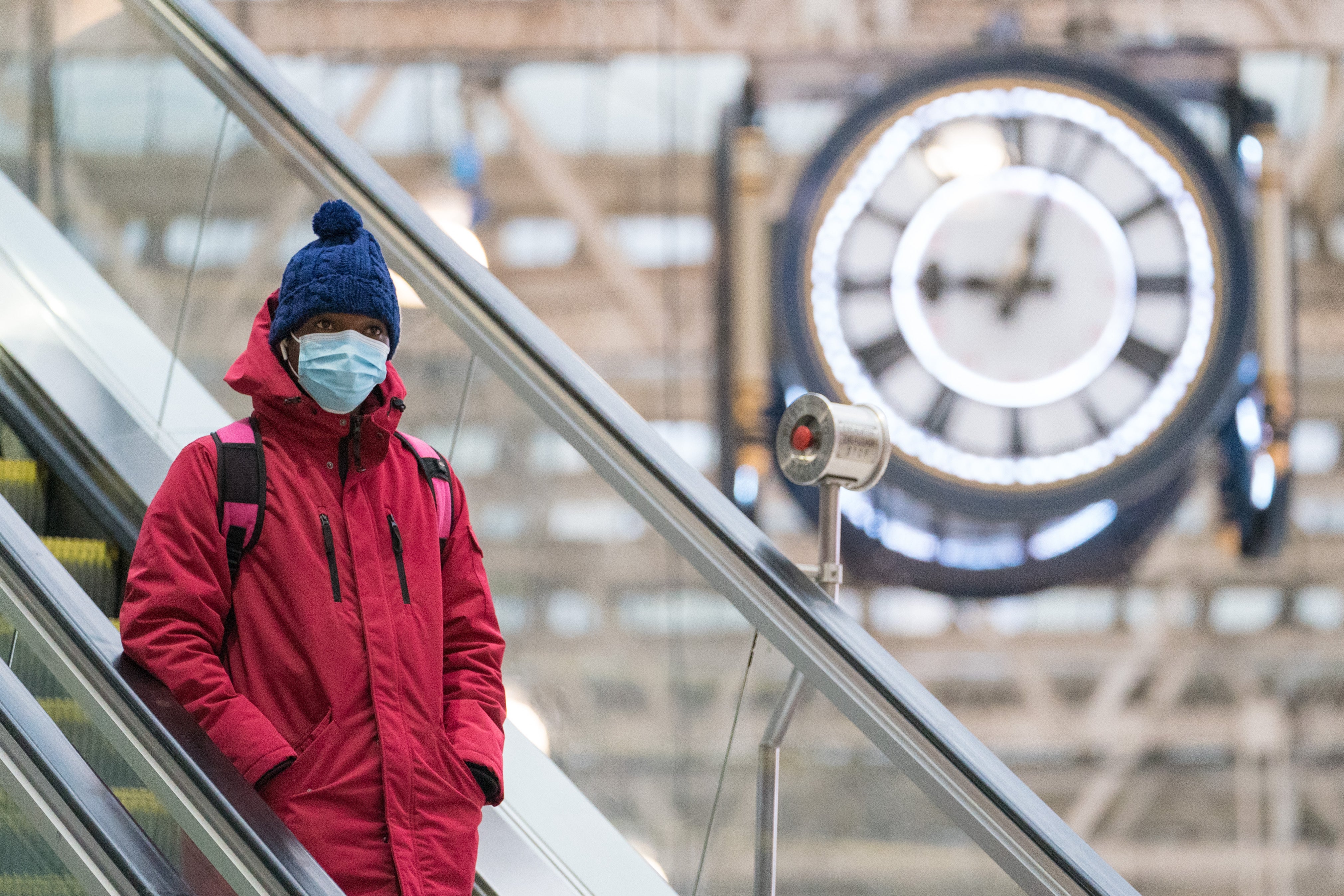 A passenger wearing a face mask at Waterloo station in London (Dominic Lipinski/PA)