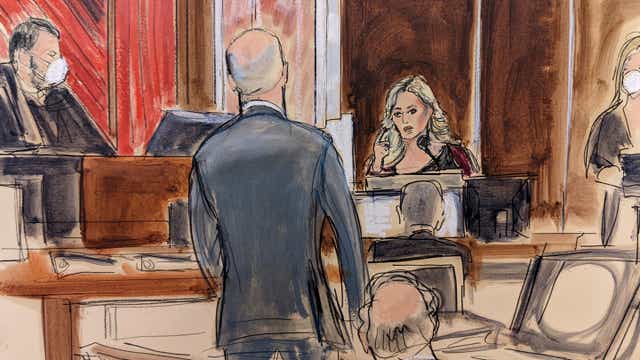 <p>Stormy Daniels testifying on the witness stand, at right, points to Michael Avenatti, standing at center. Judge Jesse Furman presides on the bench</p>