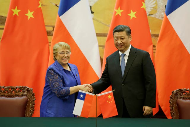 <p>Former Chilean President Michelle Bachelet (L) and Chinese President Xi Jinping attend a signing ceremony ahead of the Belt and Road Forum in Beijing, China in 2017</p>