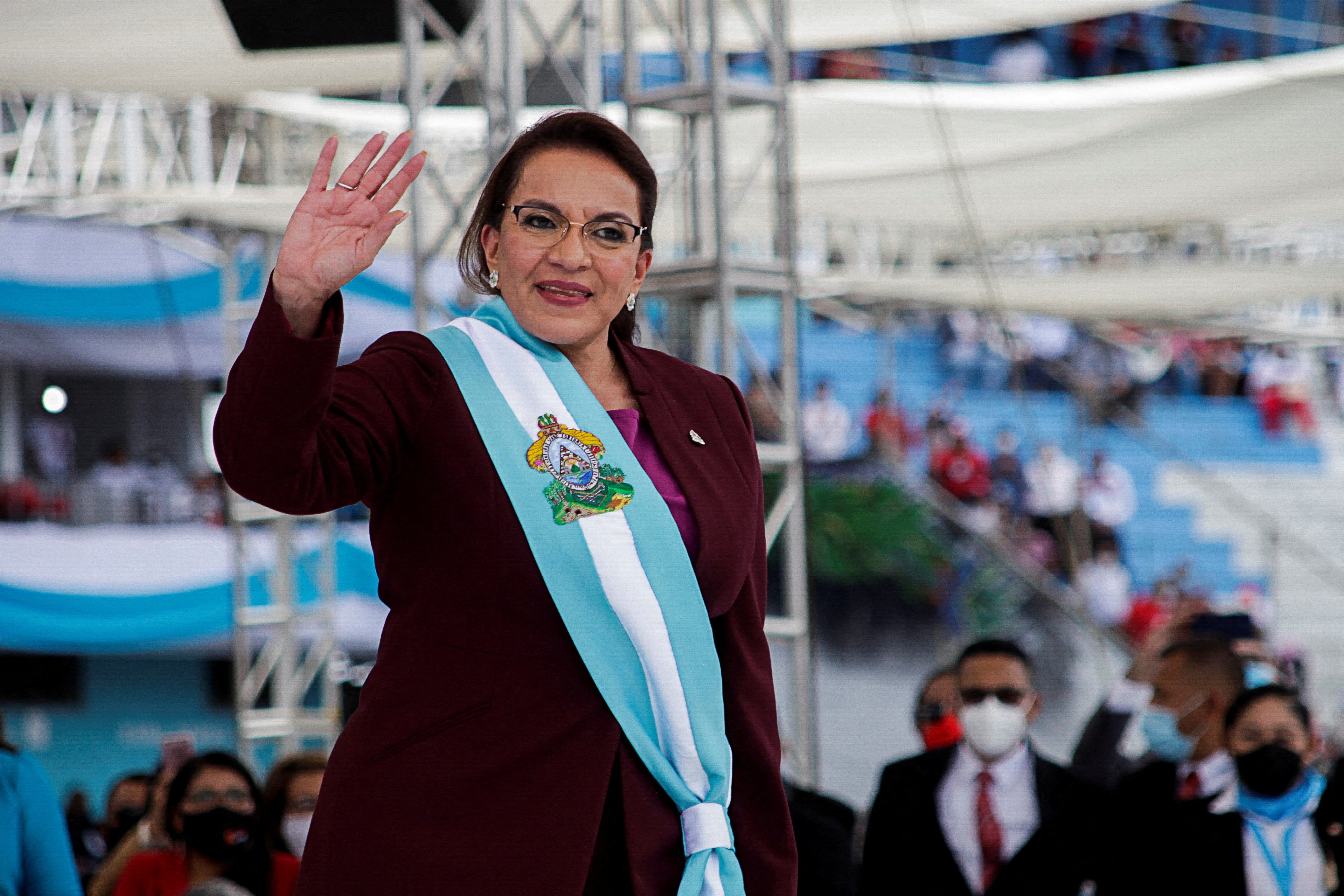 New Honduran President Xiomara Castro waves to invitees after being sworn-in, during a ceremony in Tegucigalpa