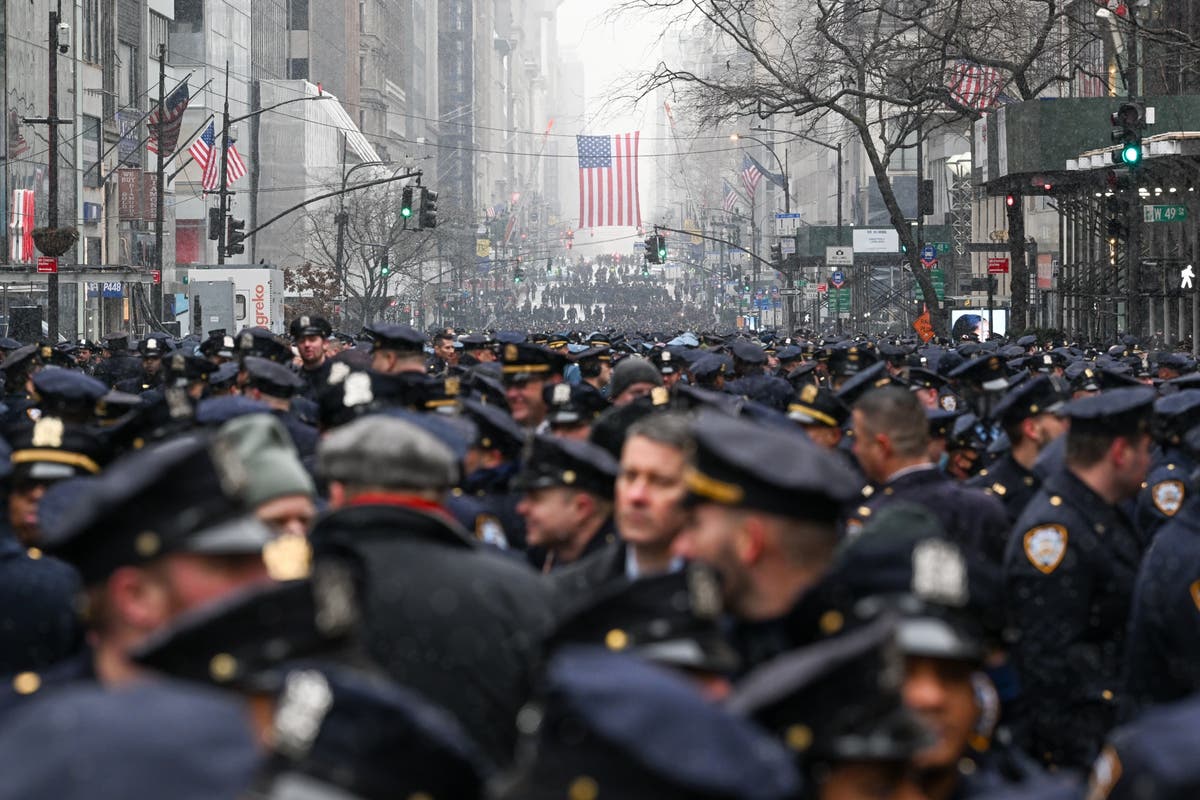 Thousands of police gather in New York to mourn slain officer