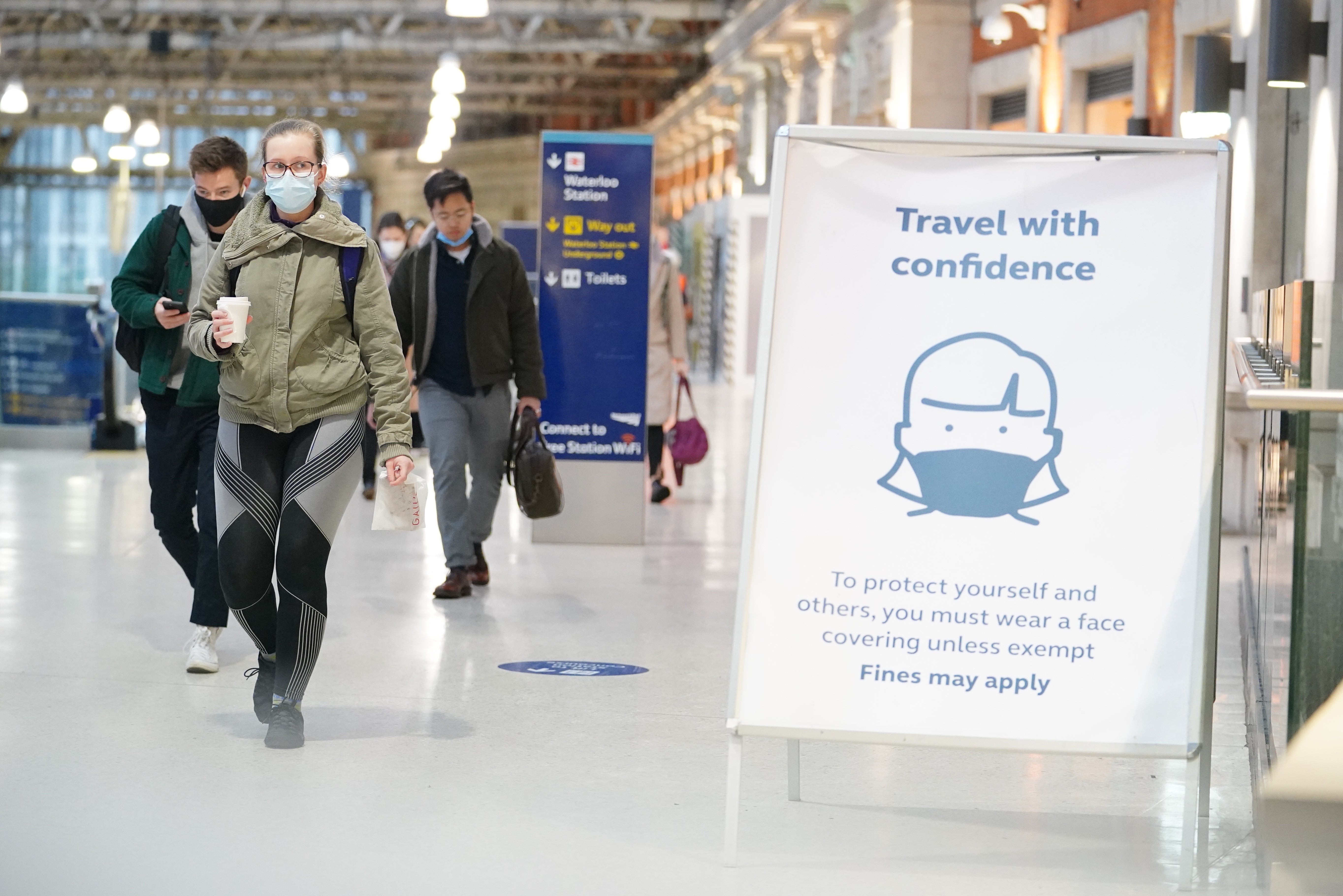 Passengers at Waterloo station in London (Dominic Lipinski/PA)