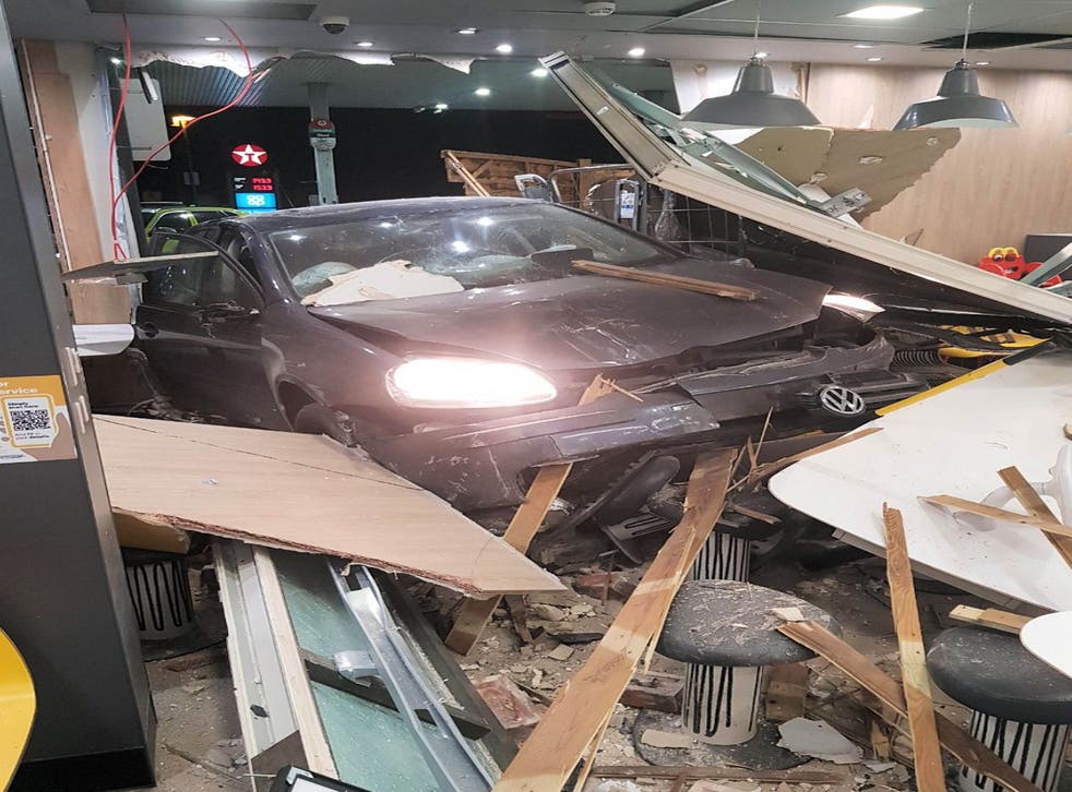A car which crashed into a McDonald’s restaurant at Buck Barn services on the A24 near Horsham (Sussex Police/PA)