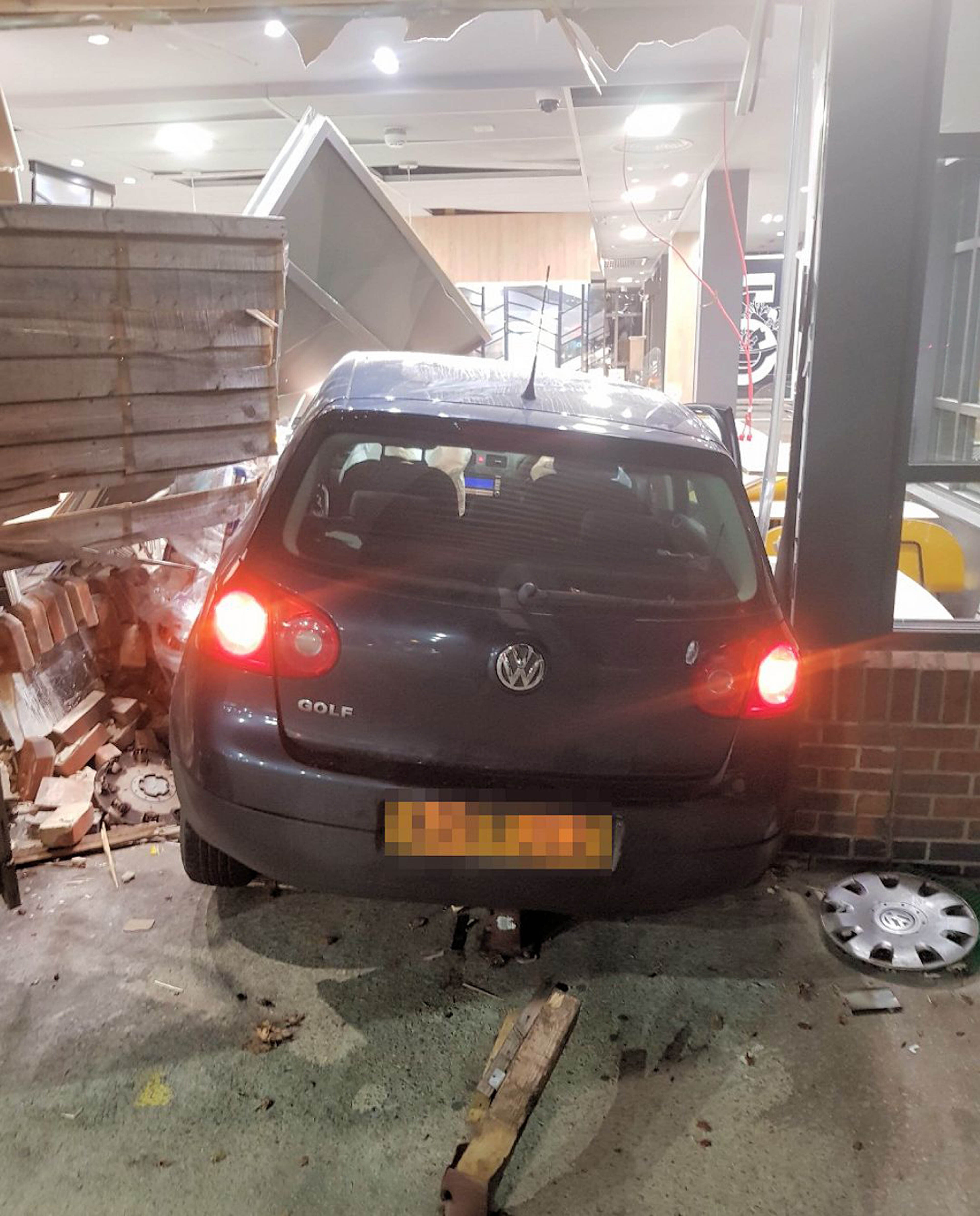A car which crashed into a McDonald’s restaurant at Buck Barn services on the A24 near Horsham (Sussex Police/PA)