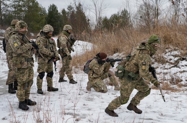 Members of Ukraine’s Territorial Defence Forces train near Kyiv (Efrem Lukatsky/AP)