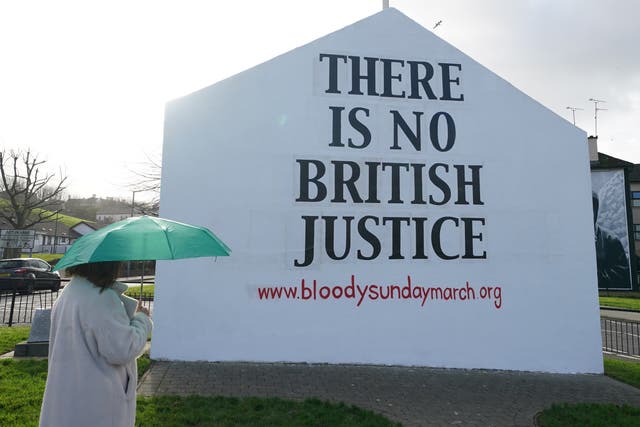A woman looks at Free Derry Corner ahead of the 50th anniversary of Bloody Sunday (Brian Lawless/PA)