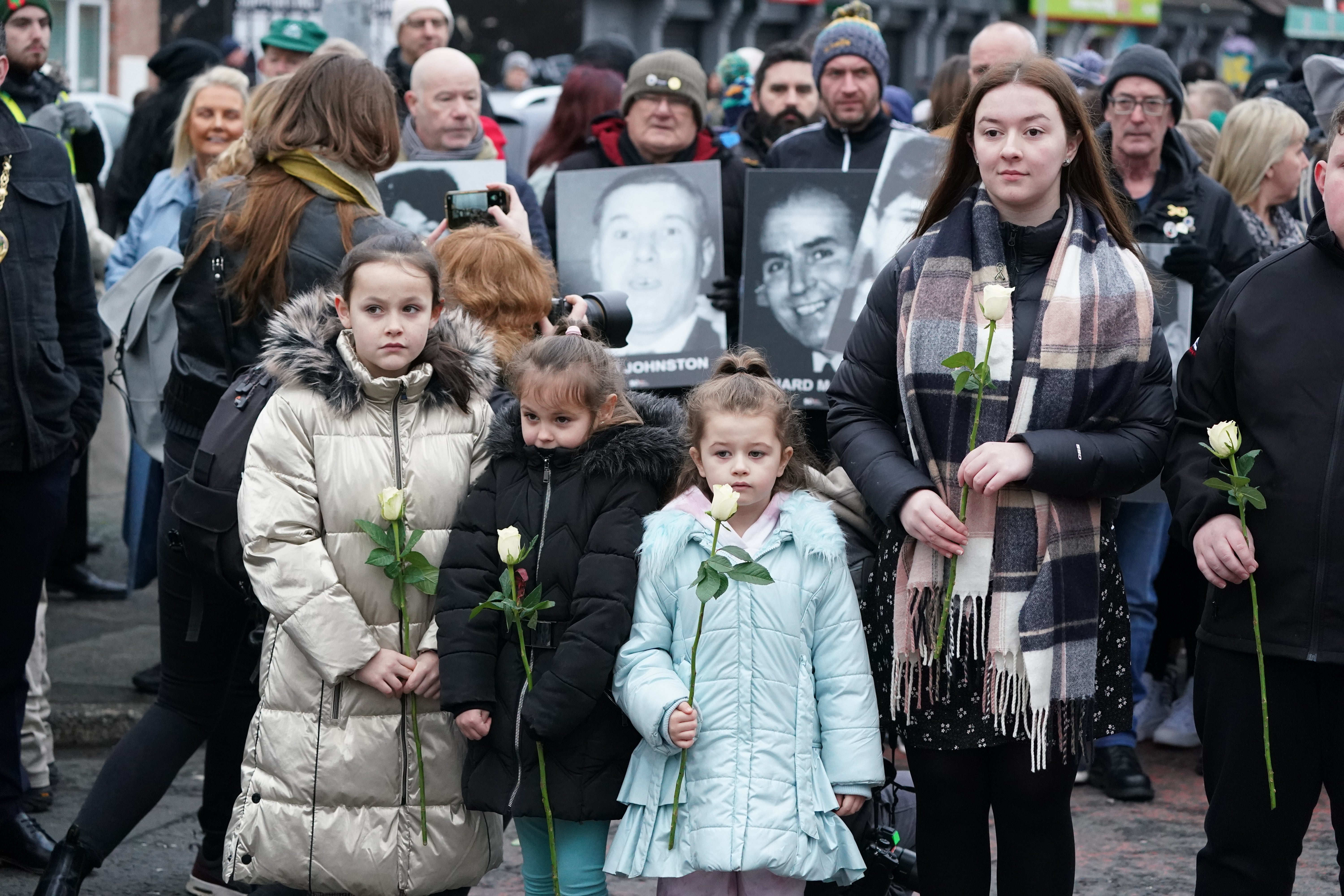 Families in the Creggan area of Derry before the remembrance walk (Brian Lawless/PA)