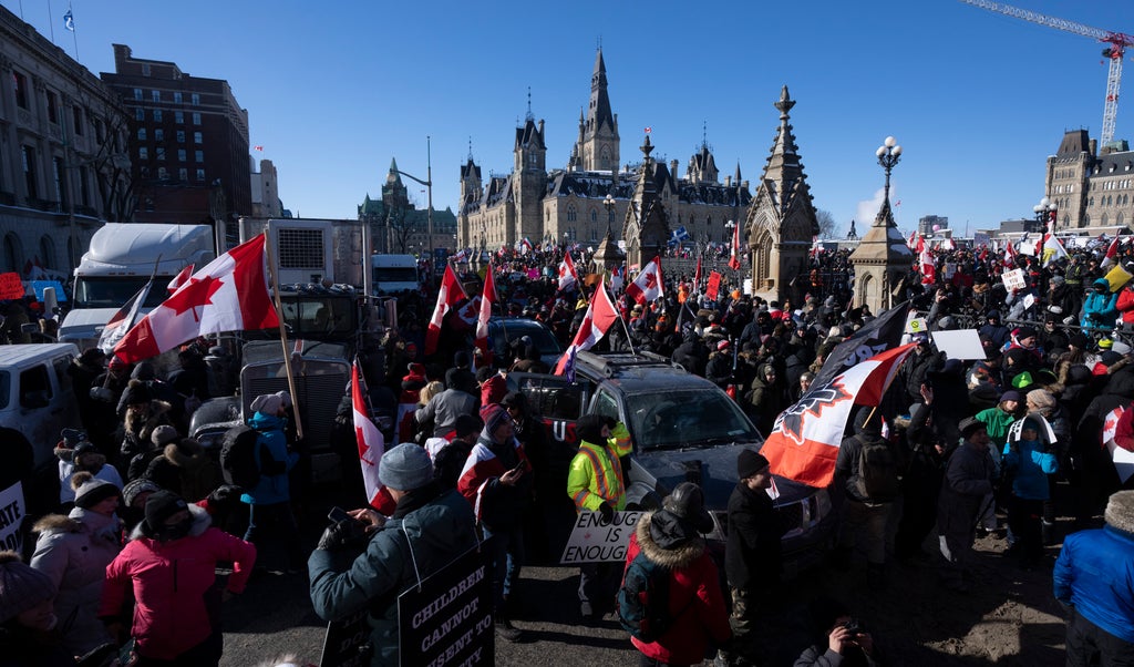 Canadian police investigate monument ‘desecration’ and ‘illegal’ behaviour by Freedom Convoy protesters