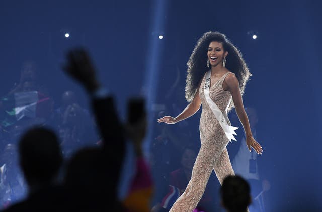 <p>Miss USA Cheslie Kryst walks on stage during the 2019 Miss Universe pageant at the Tyler Perry Studios in Atlanta, Georgia on December 8, 2019</p>
