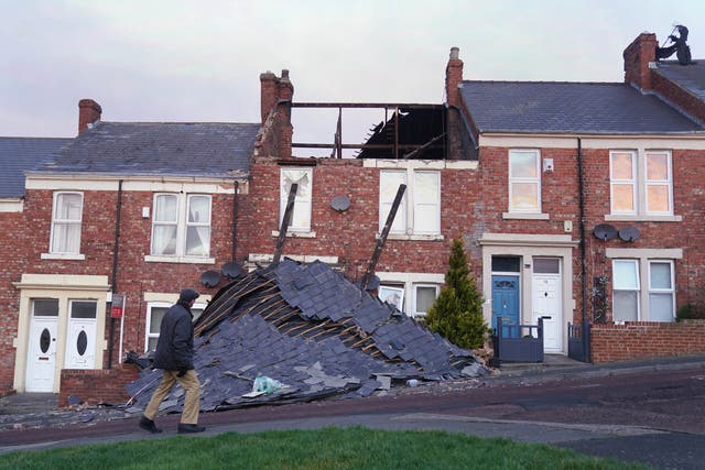 <p>A house on Overhill terrace in Bensham, Gateshead, which lost its roof during Storm Malik (Owen Humphreys/PA)</p>