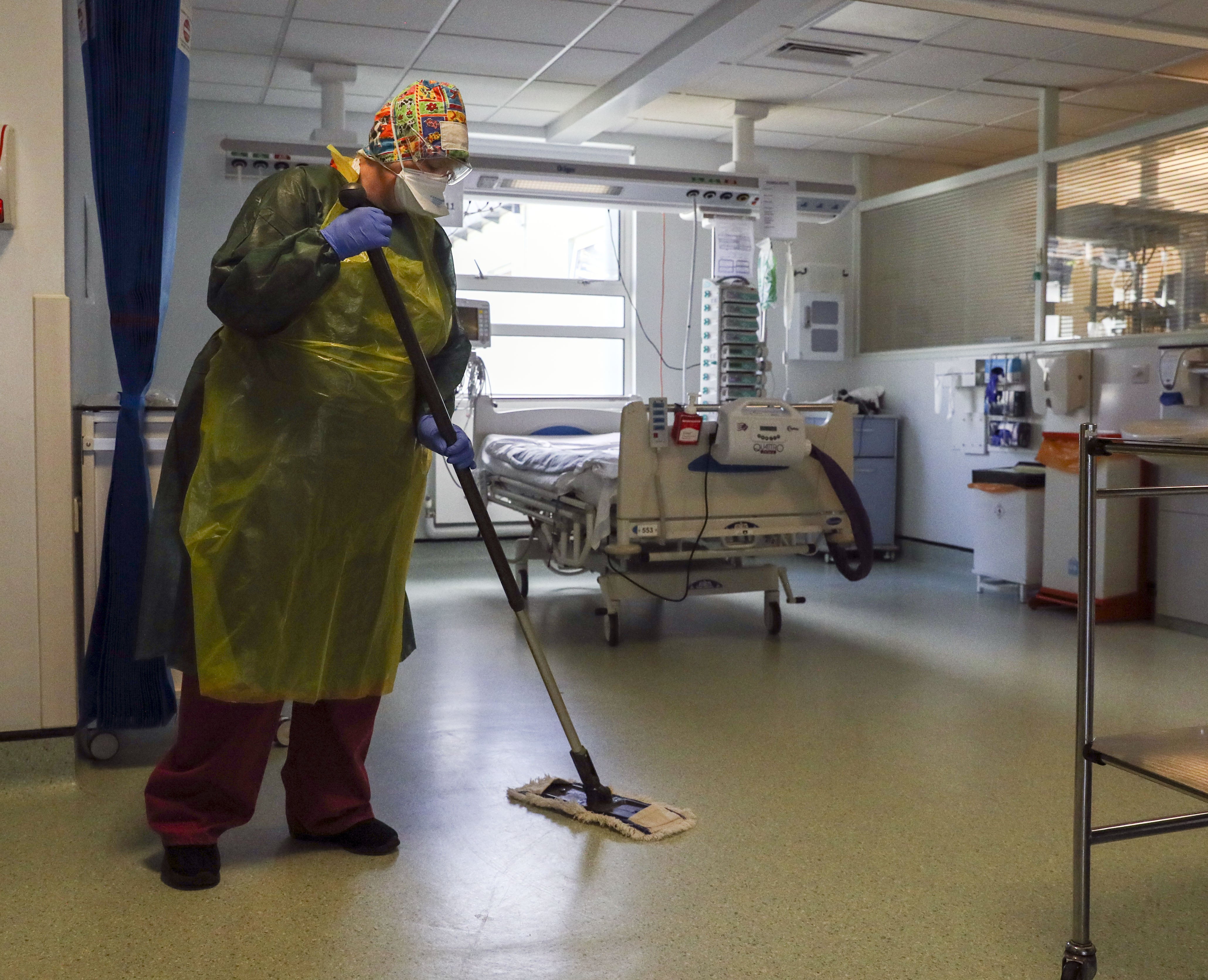 File photo dated 27/5/2020 of a cleaner working on a hospital ward (Steve Parsons/PA)