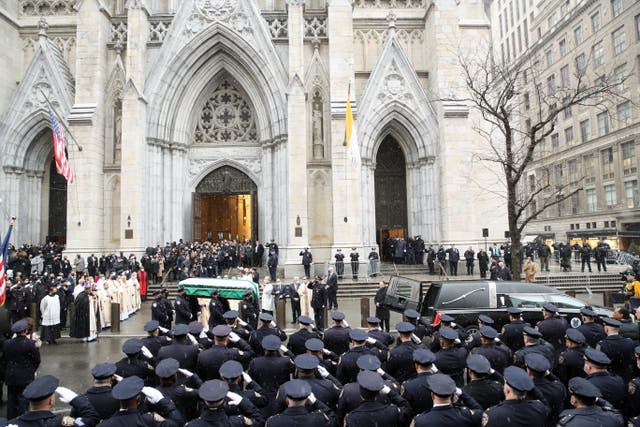 <p>The casket of fallen NYPD Officer Jason Rivera is brought out of St Patrick’s Cathedral during his funeral on 28  January 2022 in New York City</p>