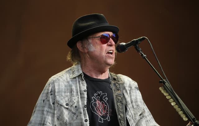 Neil Young accused Spotify of ‘spreading false information about vaccines – potentially causing death’ by hosting The Joe Rogan Experience podcast (Isabel Infantes/PA).