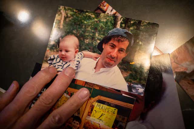 <p>Jamie Raskin goes through family photos of his son, Tommy.</p>