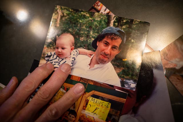 <p>Jamie Raskin goes through family photos of his son, Tommy.</p>