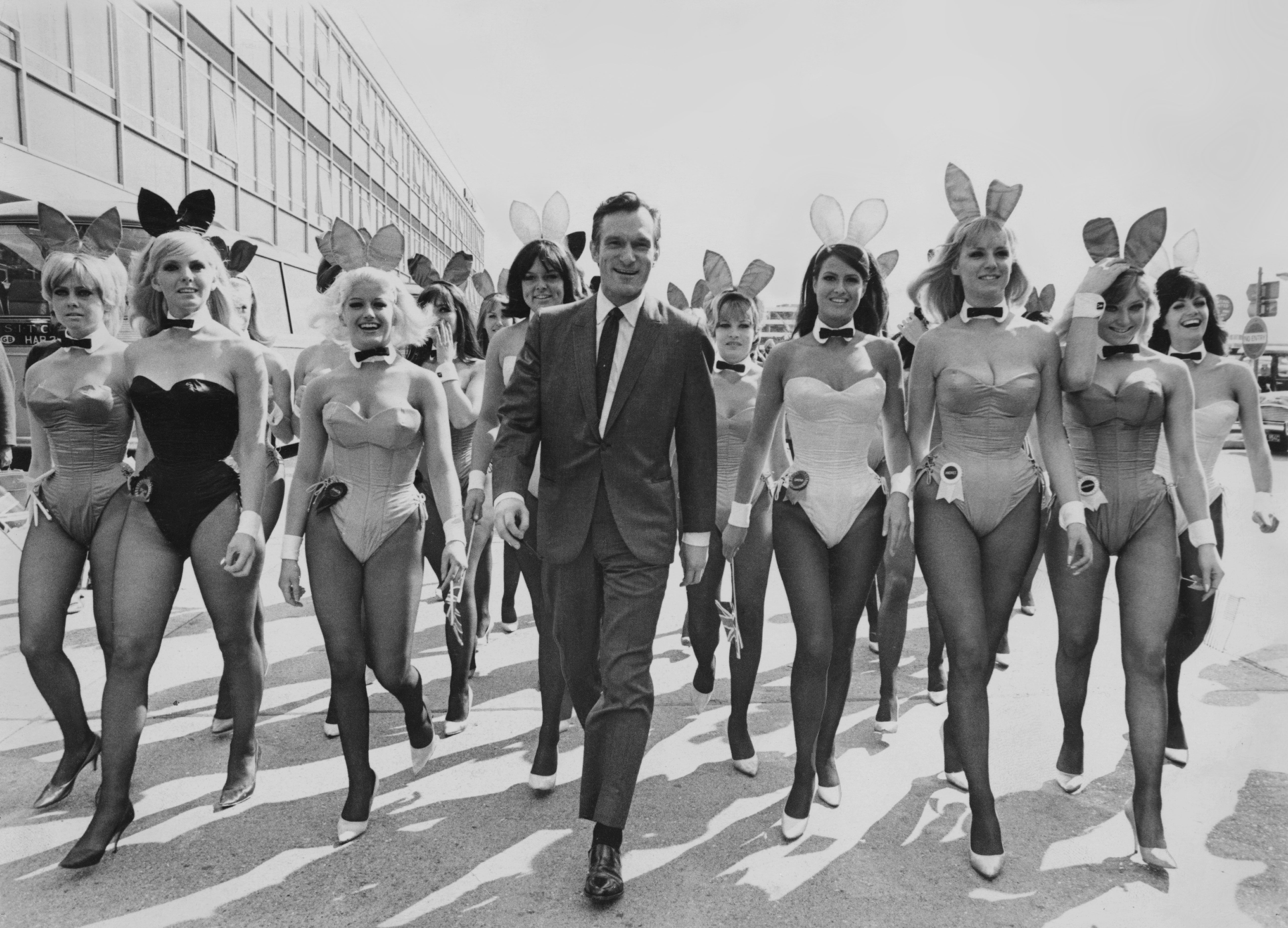 Hugh Hefner arrives at Heathrow Airport (then known as London Airport) on 26 June 1966 with an entourage of Playboy bunnies