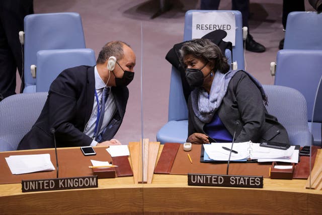 <p>UK Deputy Permanent Representative to the United Nations James Kariuki and U.S. Ambassador to the United Nations Linda Thomas-Greenfield attend a meeting of the U.N. Security Council on the situation between Russia and Ukraine, at the United Nations Headquarters in Manhattan, New York City, U.S., January 31, 2022. REUTERS/Andrew Kelly</p>