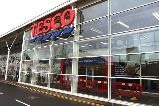 Supermarket giant Tesco has said more than 1,400 staff are at risk of redundancy over changes to overnight working (Andrew Milligan/PA)