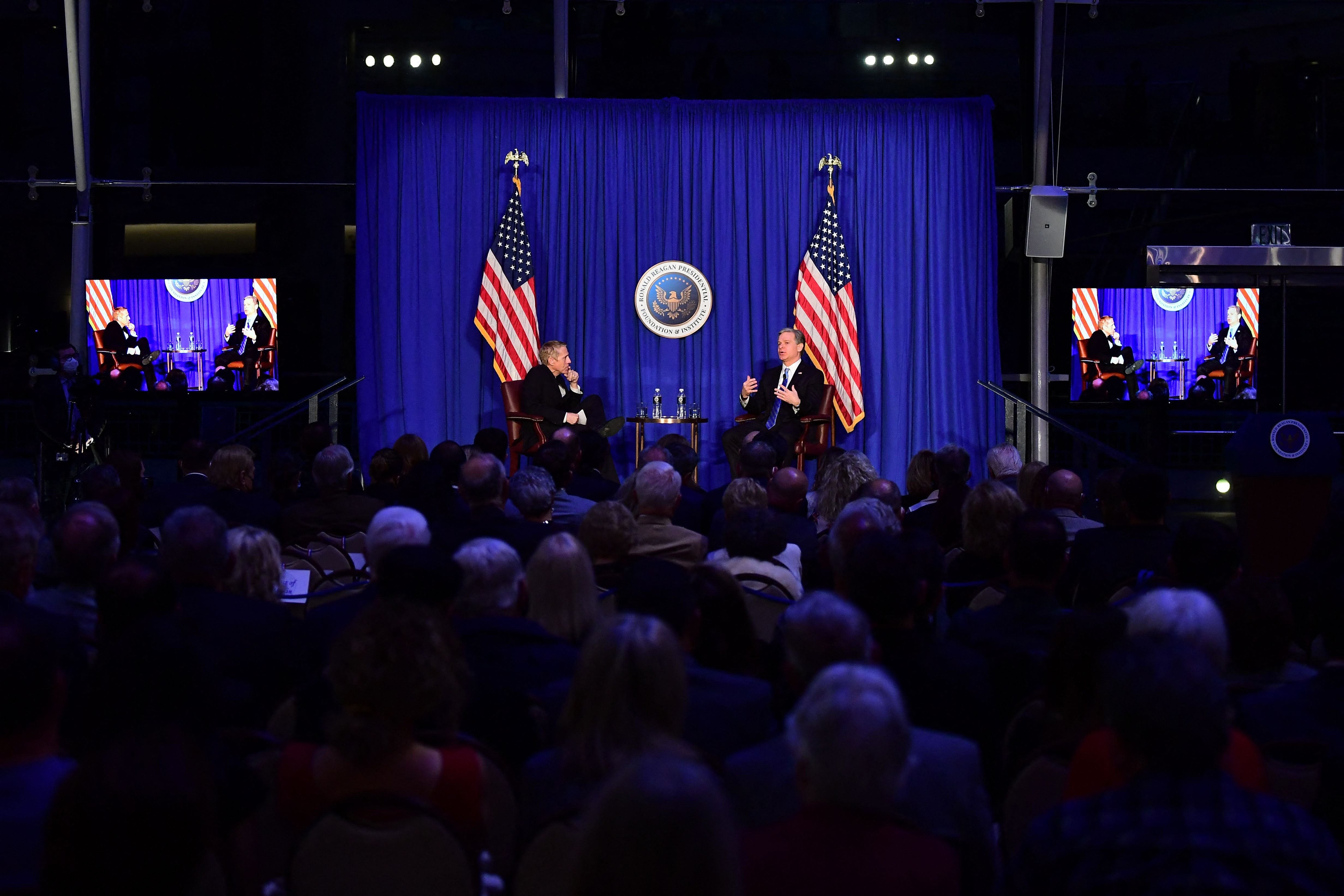 FBI director Christopher Wray (R) speaks at the Reagan Library in Simi Valley, California, 31 January, 2022.