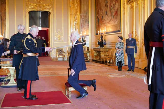 Cinematographer Sir Roger Deakins is knighted by the Prince of Wales at Windsor Castle (Jonathan Brady/PA)