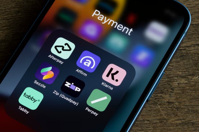 <p>Buy Now Pay Later apps on an iPhone. Klarna alone facilitates around two million transactions every day</p>