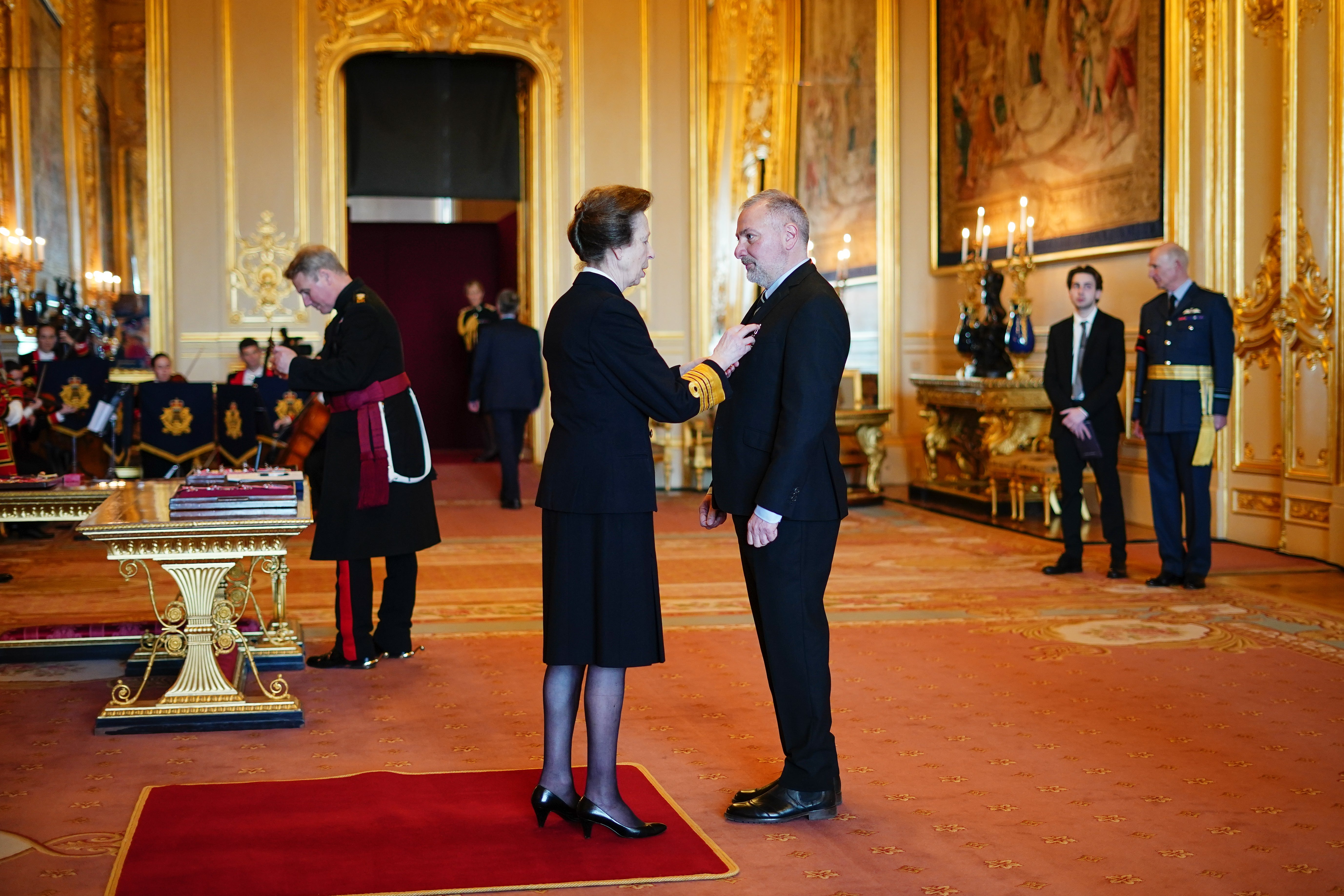 Mercurio receives his OBE from the Princess Royal at Windsor Castle (Aaron Chown/PA)