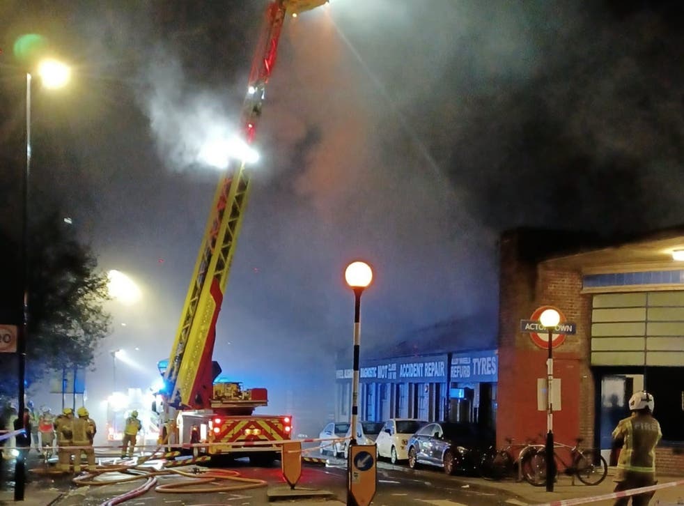 <p>Firefighters tackling a blaze at a car garage on Bollo Lane, Acton</p>