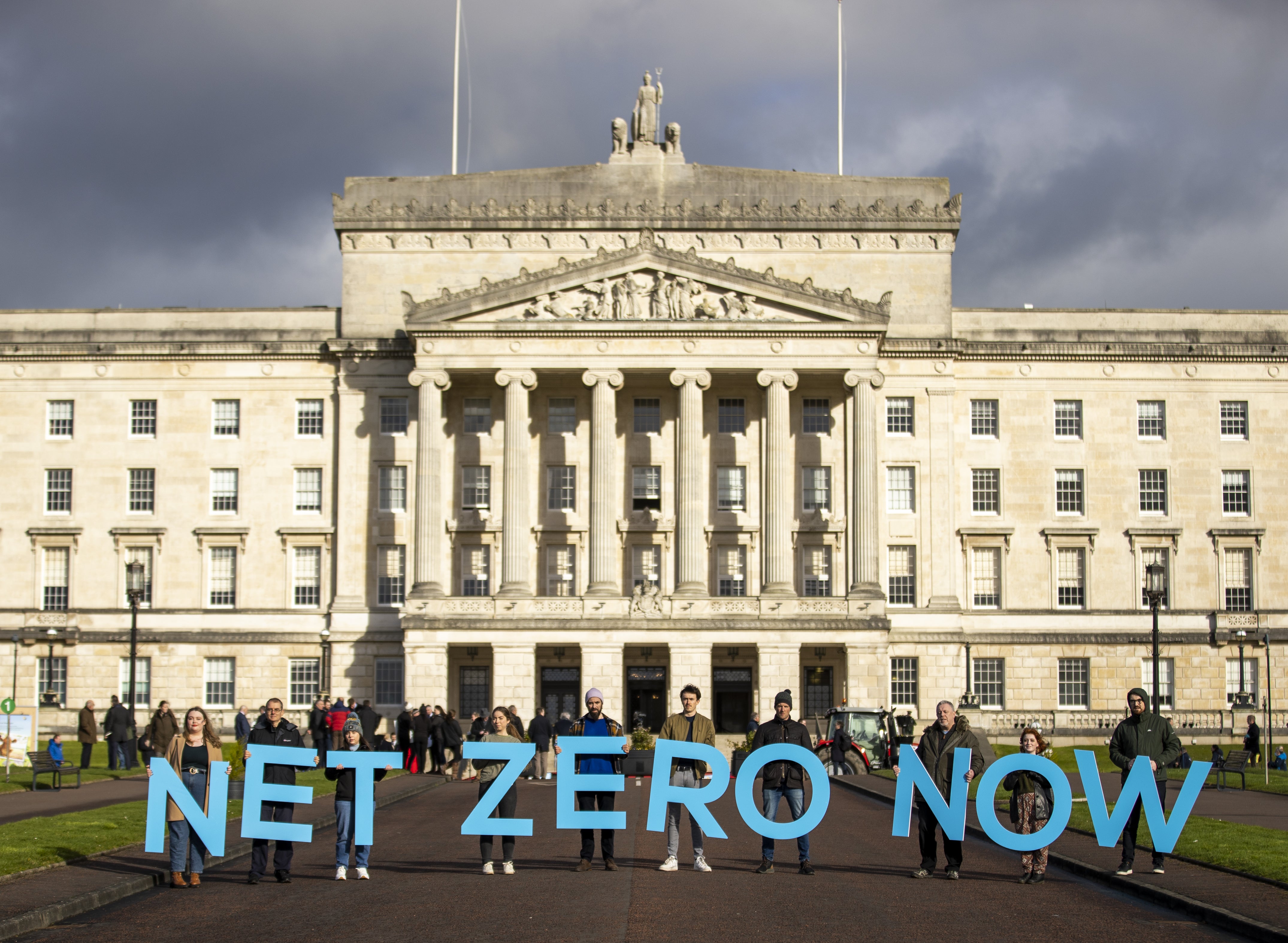 Net Zero Now activists at Stormont’s Parliament Buildings (Liam McBurney/PA)