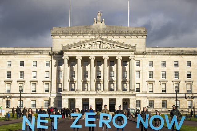 Net Zero Now activists at Stormont’s Parliament Buildings (Liam McBurney/PA)