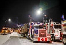 Biden urges Trudeau to use federal powers to end Canada trucker convoy’s bridge blockade