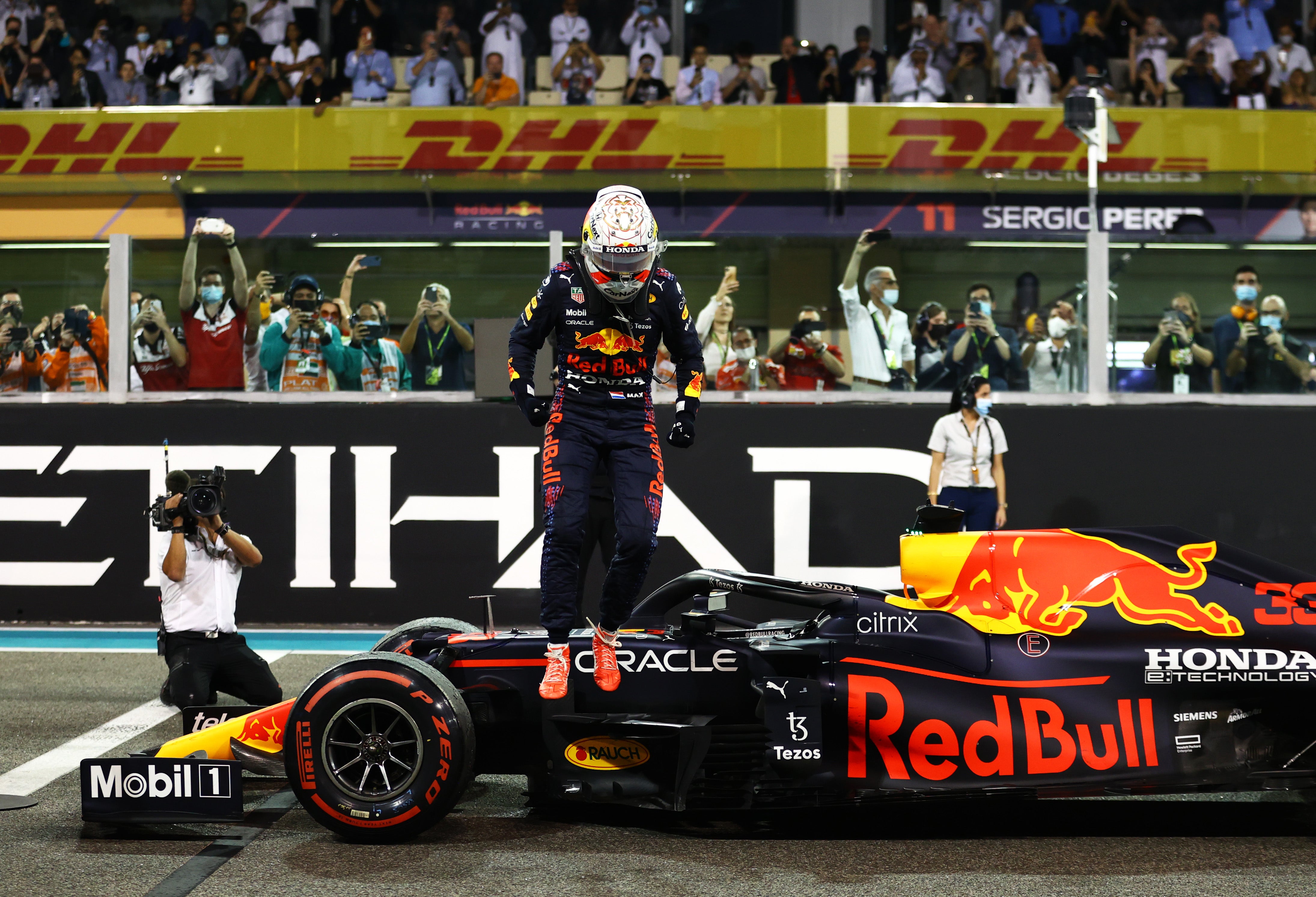 Max Verstappen secured his first world title with victory in Abu Dhabi