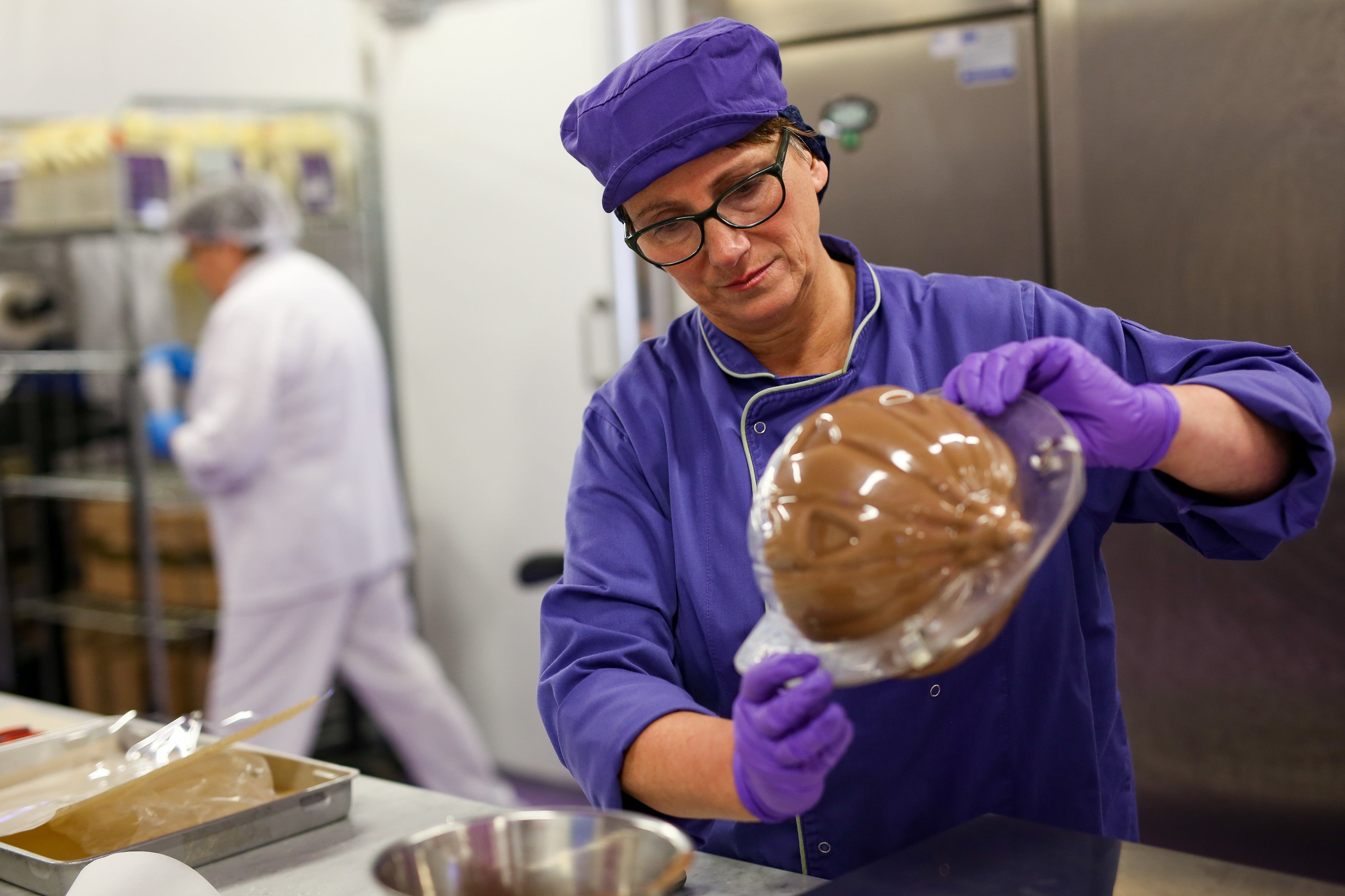 Cadbury World chocolatier, Donna Oluban, creates a chocolate pumpkin (Jacob King/PA)
