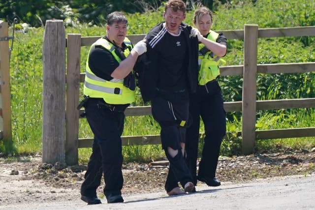 Daniel Boulton being detained at Hallington House Farm, on the outskirts of Louth, Lincolnshire (PA)