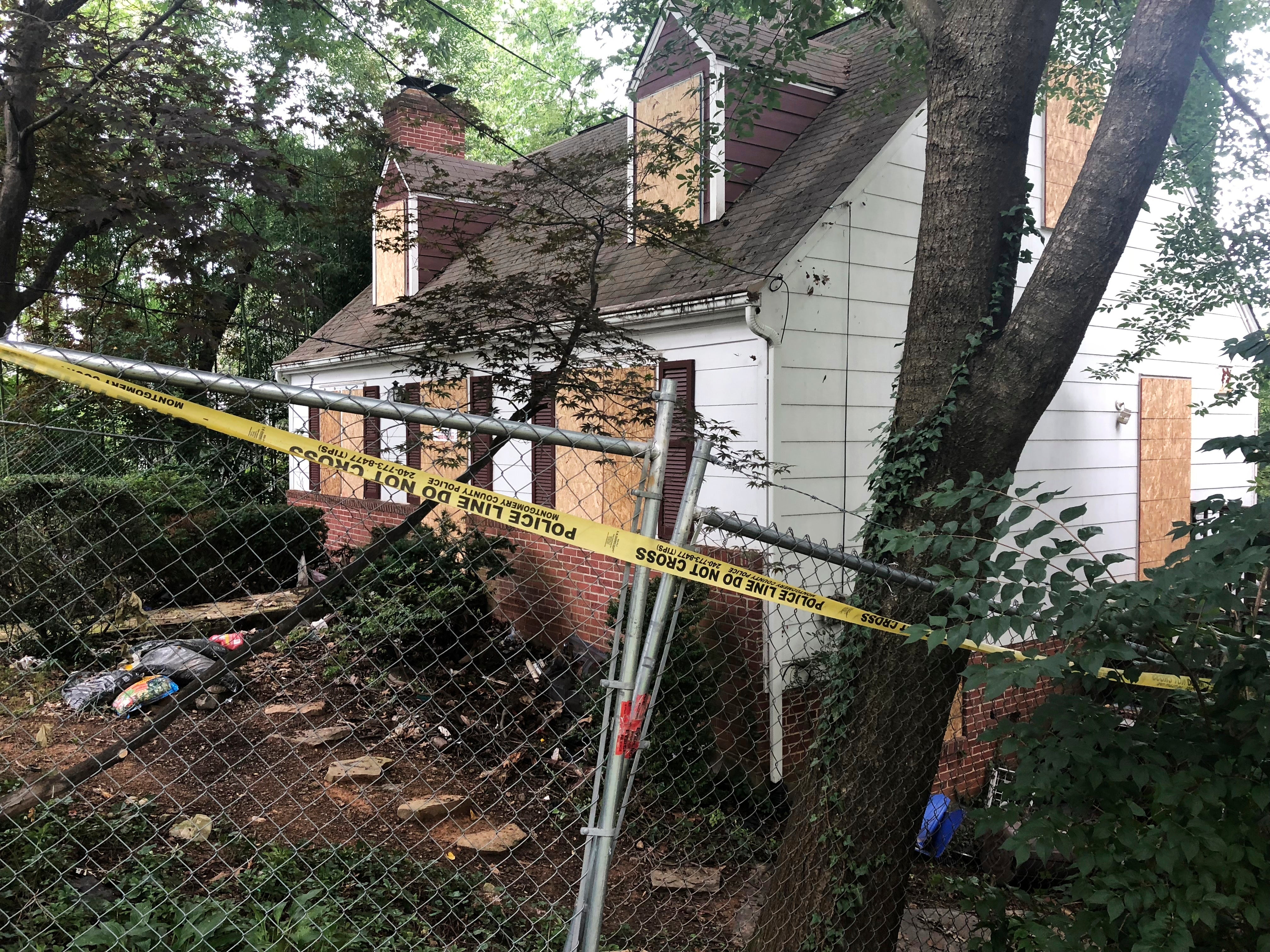 Police tape surrounds the home where Khafra was killed