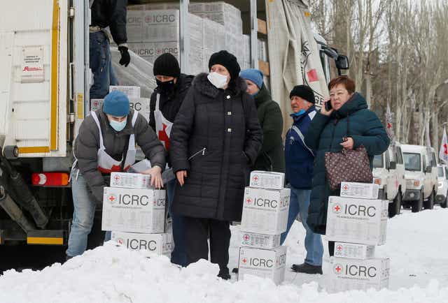 <p>Local residents gather near a Red Cross cargo truck in the Donetsk region, Ukraine, 1 February 2022</p>