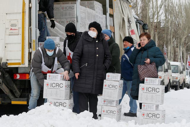 <p>Local residents gather near a Red Cross cargo truck in the Donetsk region, Ukraine, 1 February 2022</p>