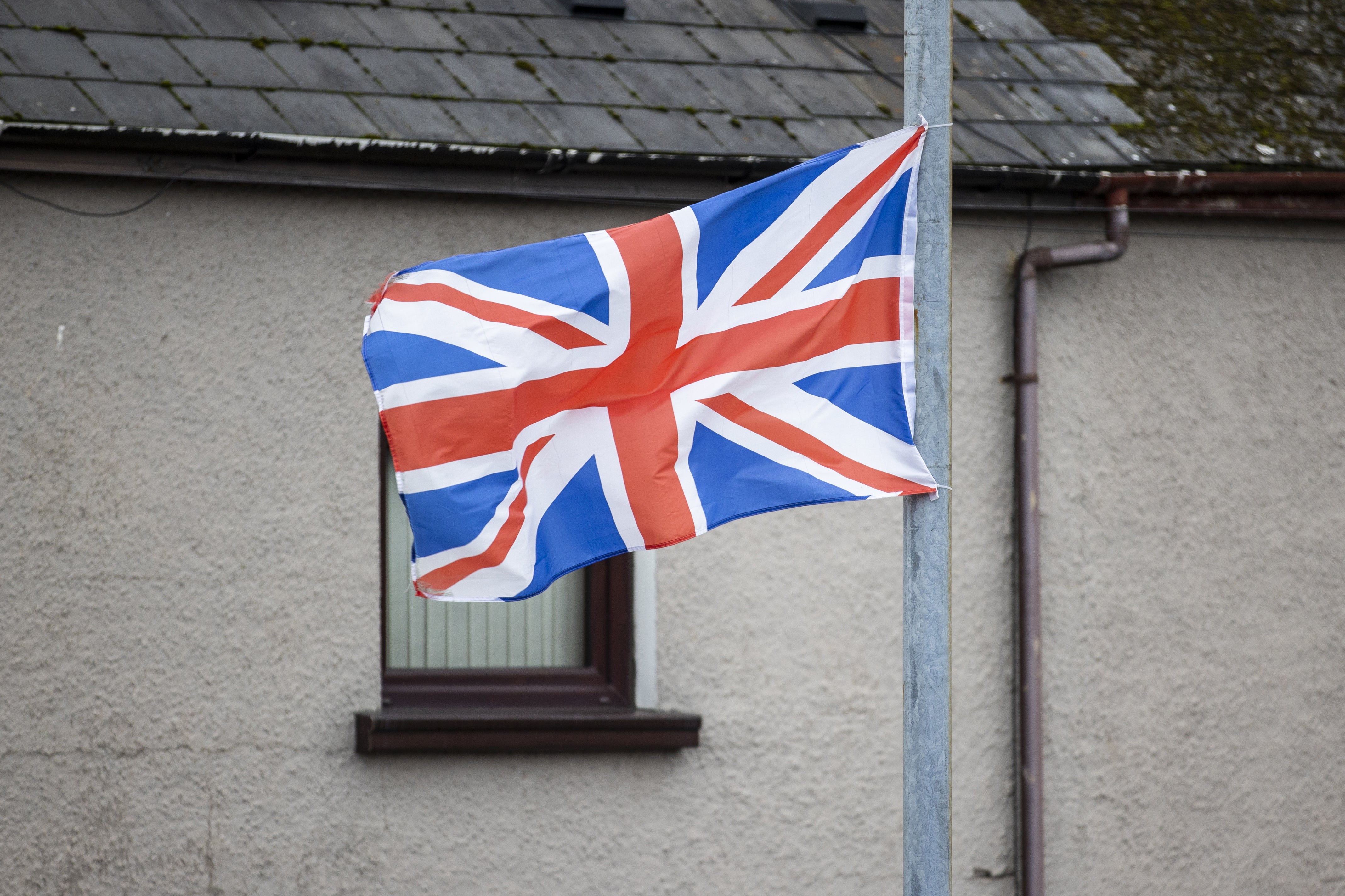 The FICT report was unable to find agreement on the issues of flying flags from lampposts (Liam McBurney/PA)