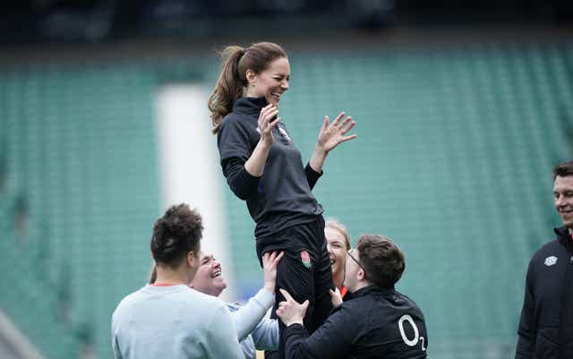 The Duchess of Cambridge is lifted up in a line-out as she plays rugby in her new role as patron of the Rugby Football Union (Yui Mok/PA)