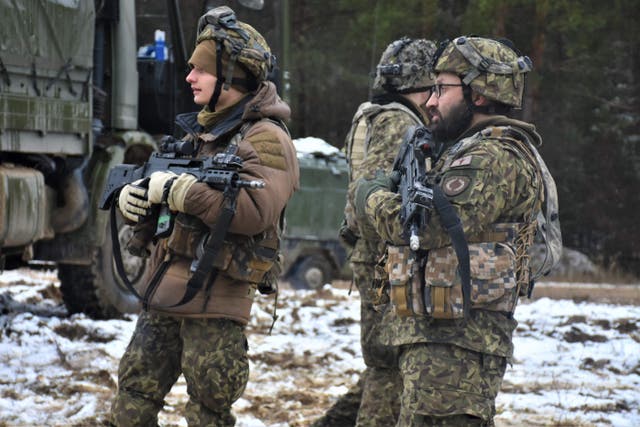 <p>Two Nato soldiers at a military exercise on January 31, 2022. The US plans to deploy troops to fortify NATO forces in eastern Europe amid fears that Russia could invade Ukraine</p>