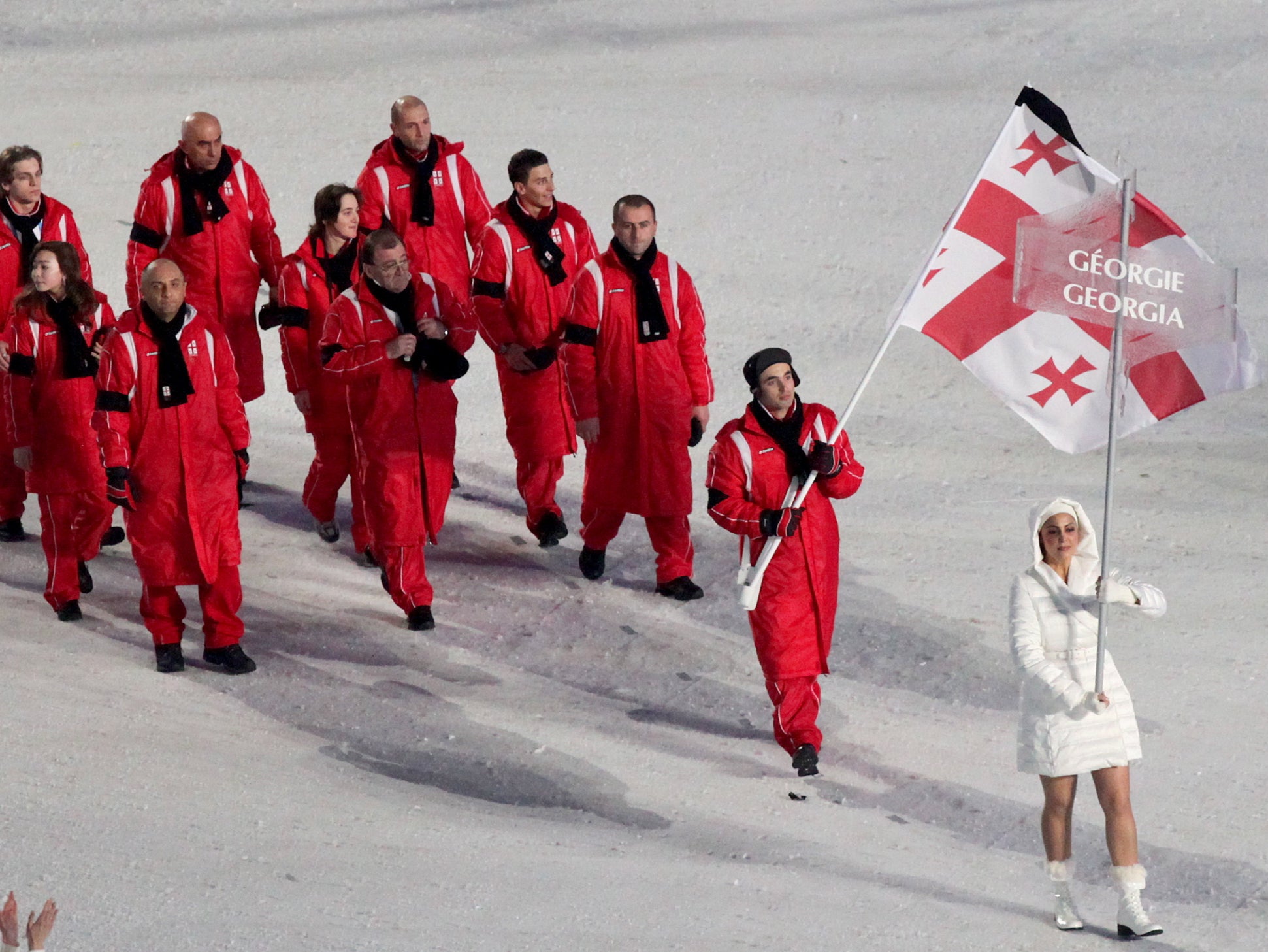 The Georgian team arrive without their luger at the 2010 opening ceremony