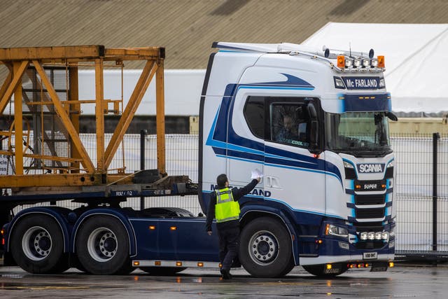 UK Border Force officer handing back paperwork to a lorry driver at the NI Department of Agriculture, Environment and Rural Affairs (DAERA) Northern Ireland Point of Entry (POE) site on Milewater Road in Belfast at the Port of Belfast (Liam McBurney/PA)