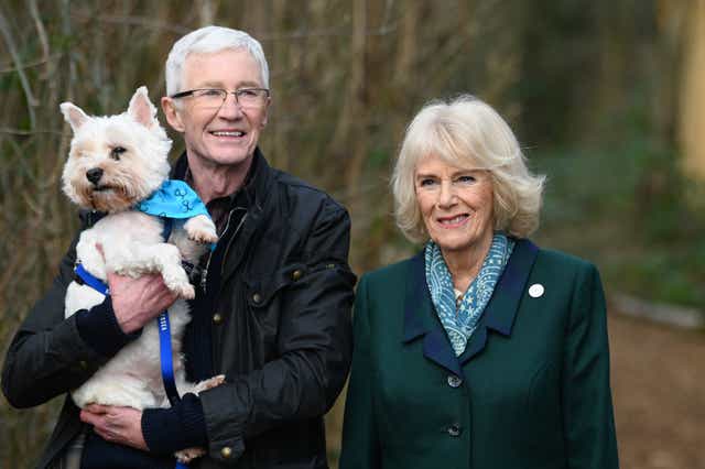 The Duchess of Cornwall goes on a walk with Battersea Ambassador Paul O’Grady and a rescue dog during her visit to the Battersea Dogs and Cats Home centre in Brands Hatch, Kent (Stuart Wilson/PA)