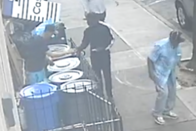<p>Prosecutors say the surveillance image shows Irvin Cartagena, left, selling fentanyl-laced heroin to the actor Michael K Williams</p>