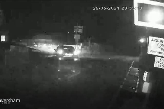 Video grab image dated from CCTV issued by the British Transport Police of drunk driver Tayler Barnham driving on to a level crossing and then on to the tracks near Faversham in Kent (British Transport Police/PA)