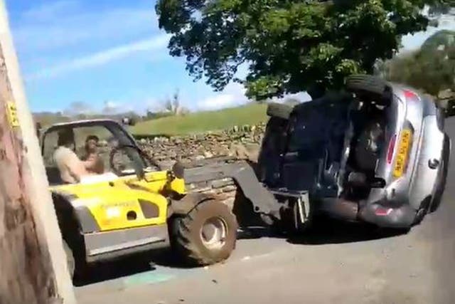 <p>Farmer overturns a car parked in his driveway in June, 2021. </p>