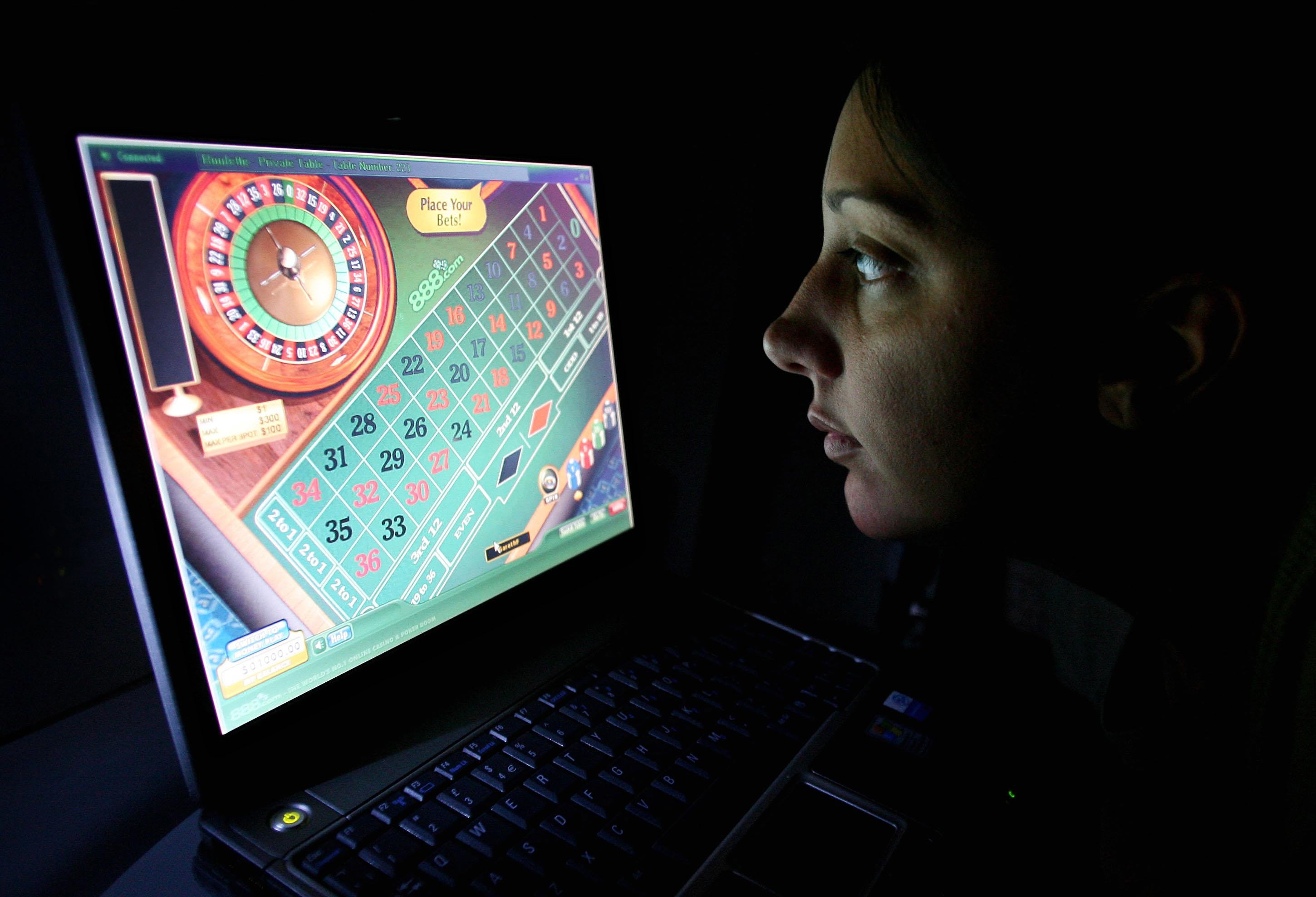 A woman uses an internet gambling website to play online roulette (Gareth Fuller/PA)