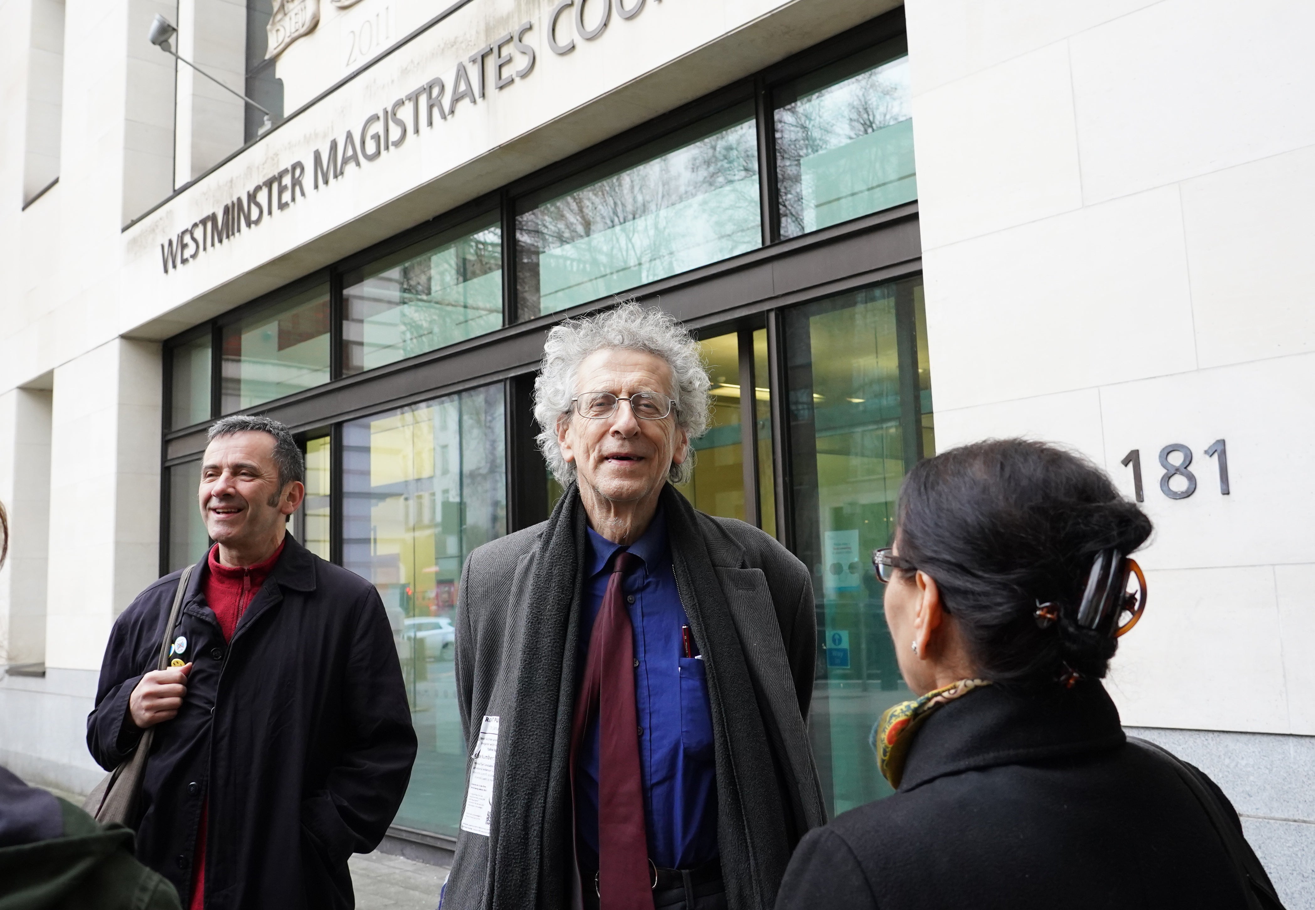 Piers Corbyn (centre) arrives at Westminster Magistrates’ Court (Ian West/PA)