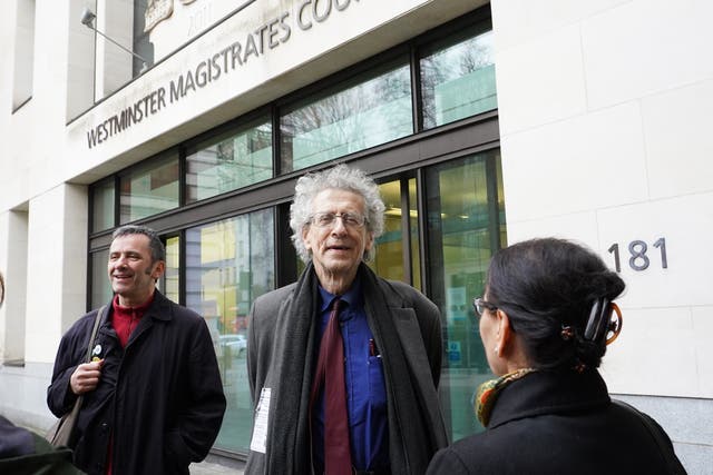 Piers Corbyn (centre) arrives at Westminster Magistrates’ Court (Ian West/PA)