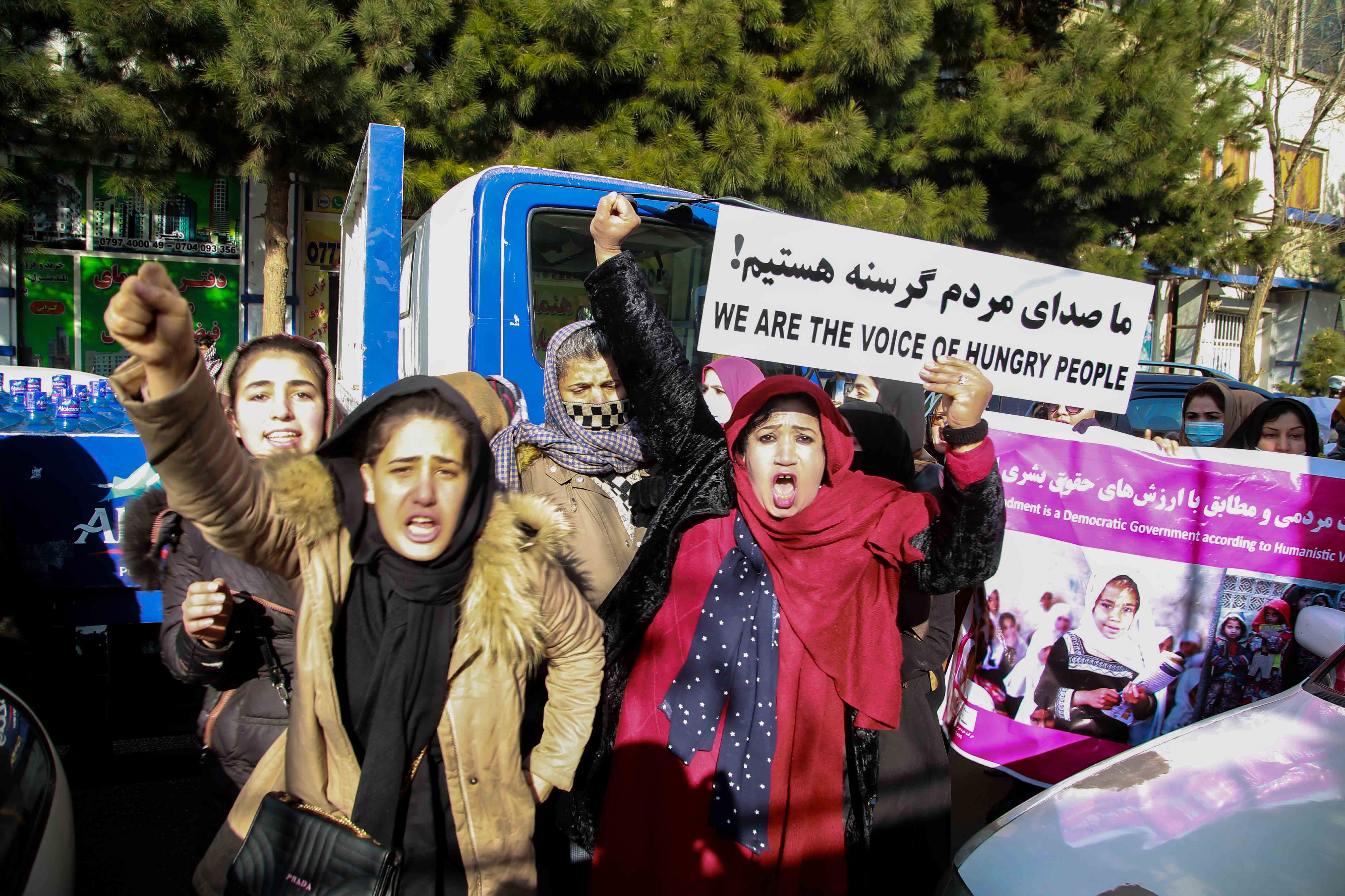 Afghan women rally against Taliban rule during a protest in Kabul, Afghanistan, 28 December 2021