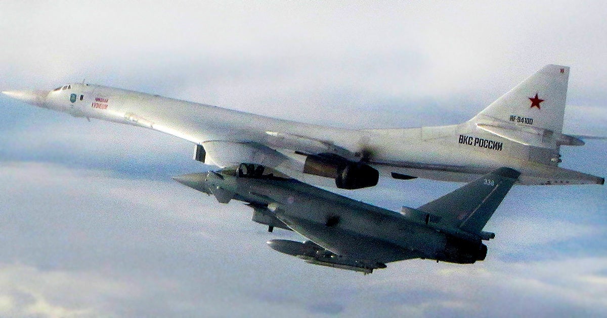 An undated photo shows a RAF fighter jet intercepting a Russian military aircraft approaching a UK area of interest